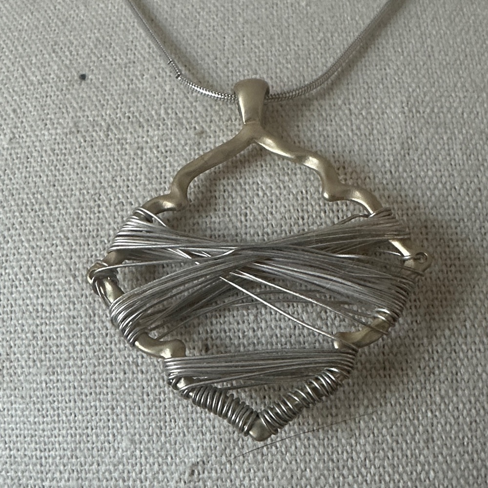 Silver and gold wrapped wire necklace.